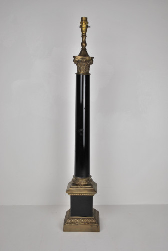 Large and heavy gilt metal table lamp in the form of an ebonised Corinthium column