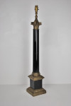 Large and heavy gilt metal table lamp in the form of an ebonised Corinthium column