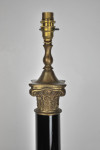 Large and heavy gilt metal table lamp in the form of an ebonised Corinthium column