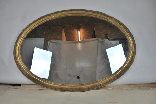 Large carved giltwood and gesso oval mirror, 19th century