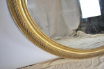 Large carved giltwood and gesso oval mirror, 19th century