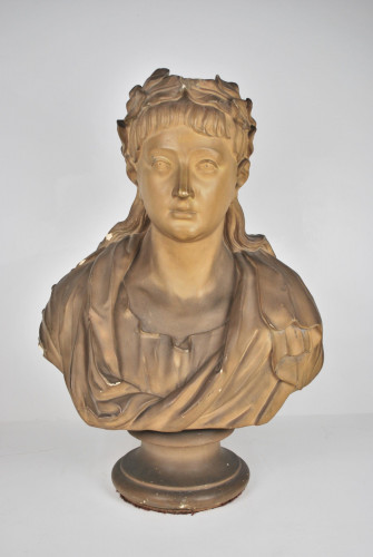 An antique plaster bust portrait of the young virgil after John Cheere, wearing a laurel wreath and toga, on a turned socle