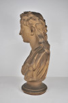 An antique plaster bust portrait of the young virgil after John Cheere, wearing a laurel wreath and toga, on a turned socle