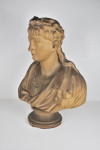 An antique plaster bust portrait of the young virgil after John Cheere, wearing a laurel wreath and toga, on a turned socle